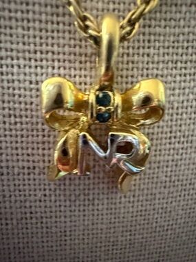 Gold Bow Nina Ricci Pendant Necklace - Women's Jewelry